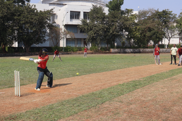 Girls playing cricket on Carvuss American Academy ground